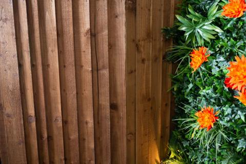 A close up picture of wooden lap garden fencing